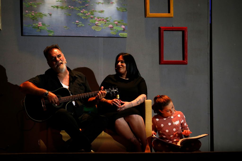 Present-day Freddie, retelling his past to his daughter and granddaughter 