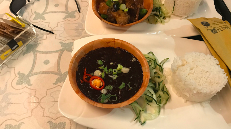 Dinuguan - basically pork pieces tossed in pig blood with a side of rice