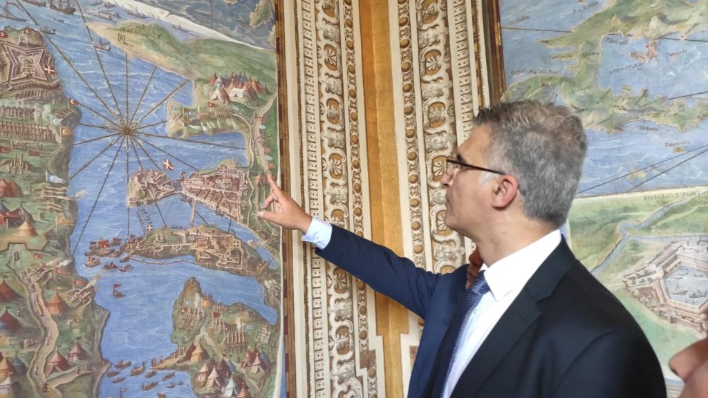 Minister Abela looking at an old map of Malta