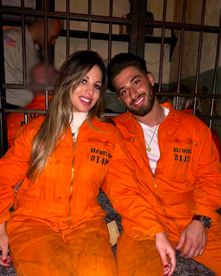 Lexi Hyzler and Kem Cetinay dining at a penitentiary-themed restaurant