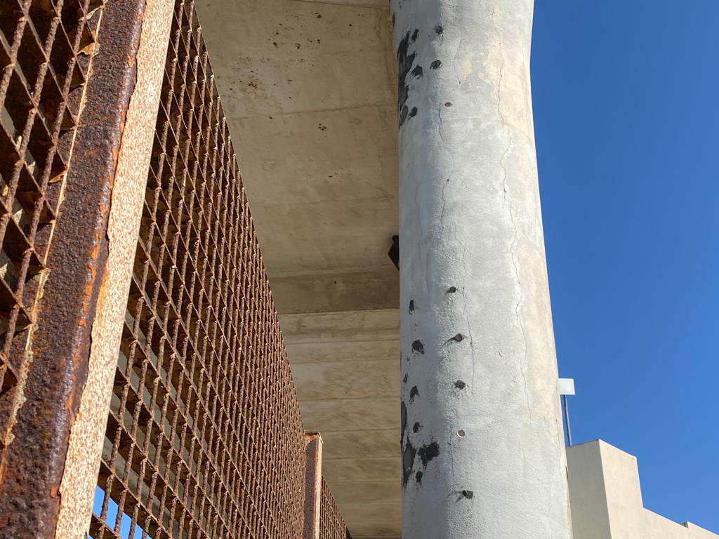 These holes indicate that concrete was extracted for testing. 