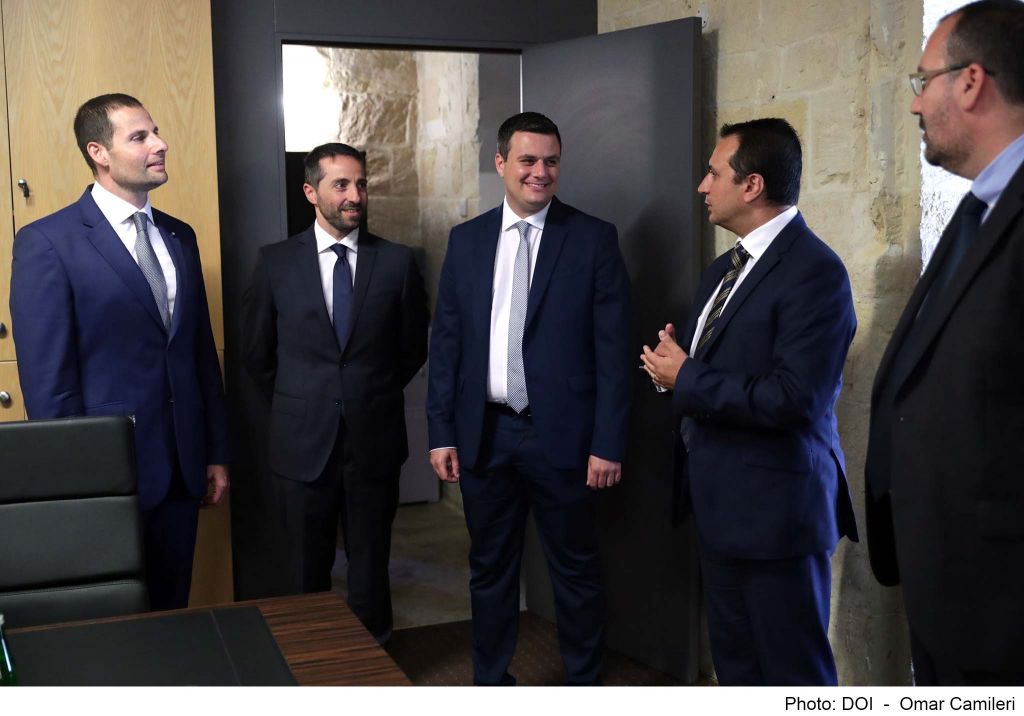 Prime Minister Robert Abela (left) and parliamentary secretary Alex Muscat (second from left) during a recent visit to the IIP Agency's offices