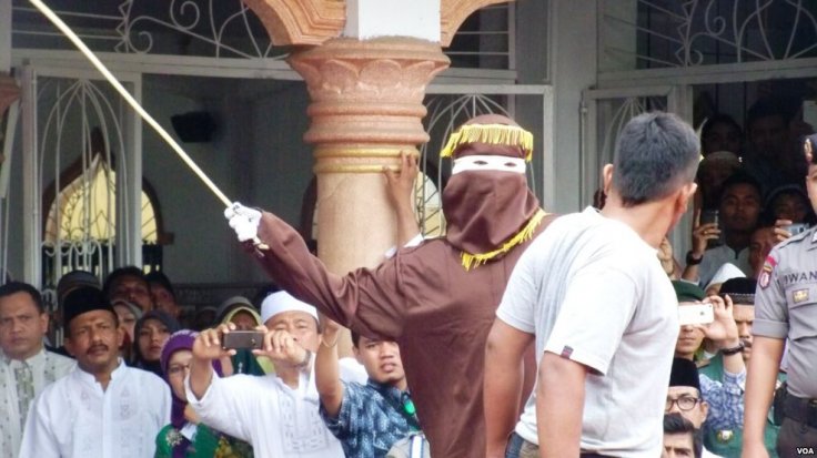A caning sentence being carried out in Banda Aceh, 19 September 2014 VOA/Wikimedia Commons