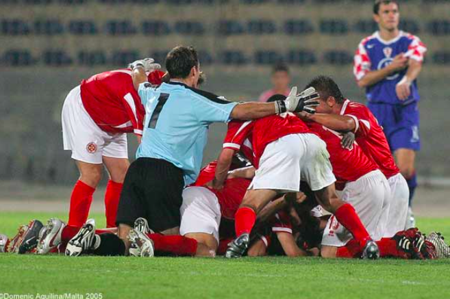 Maltese players in celebration after Stephen Wellman's goal 