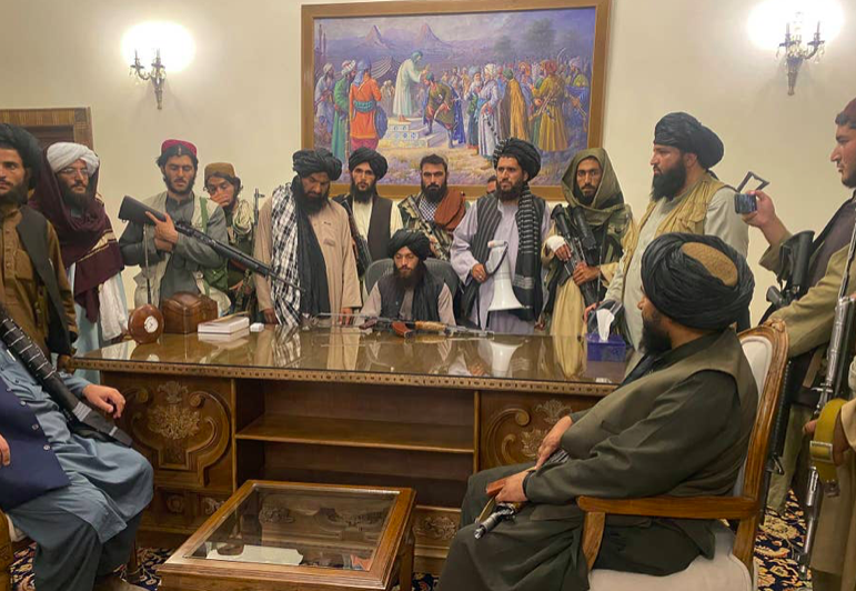 Taliban fighters take control of Afghan presidential palace in Kabul.