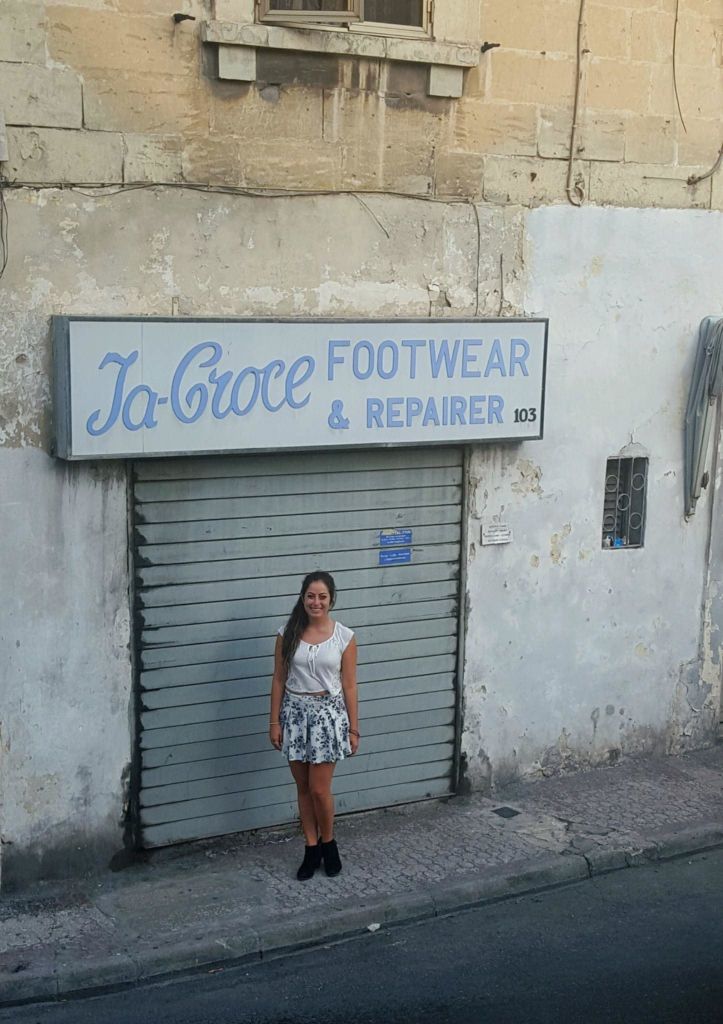 Jenise Spiteri just outside the shoe store her grandfather worked in during the 1940s, Hamrun.