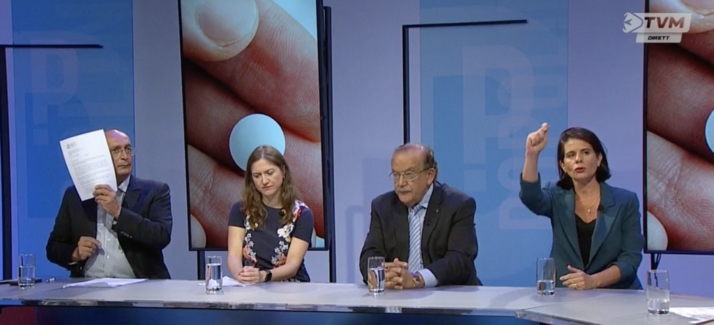 Ivan Grech Mintoff (left) flashes a copy of ABBA's police report during a Popolin debate last night