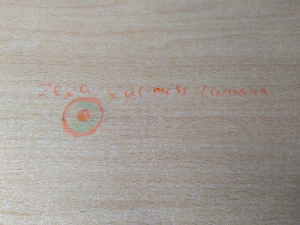 A crude message that Andrea Caruana found scribbled on a desk