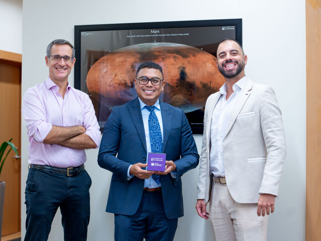 Dr Leonardo Barilaro (MCAST) with the NYUAD Provost Arlie Petters and Prof. Andrea Macciò. - Credit: Ozlem Basman Barilaro